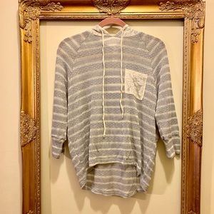 gray and cream striped hoodie with lace pocket